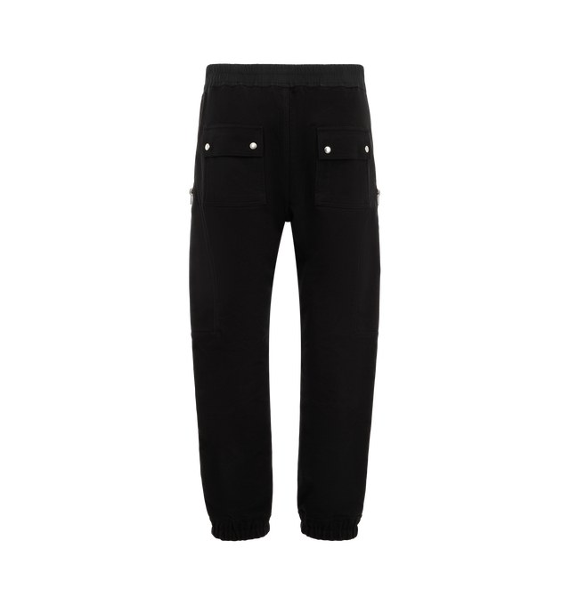 Image 2 of 3 - BLACK - Rick Owens Mens Heizer Cargo Pants are crafted from cotton poplin. Feature a slim fit, elasticized waistband with drawstring, exposed Bela front zip closure with snap detail, angled zip cargo pockets, front shin zip openings, elasticized cuffs, side welt pockets, back flap pockets with snap closures, and double topstitch detailing. Main Material: 97% Cotton, 3% Elastane. Made in Italy. 