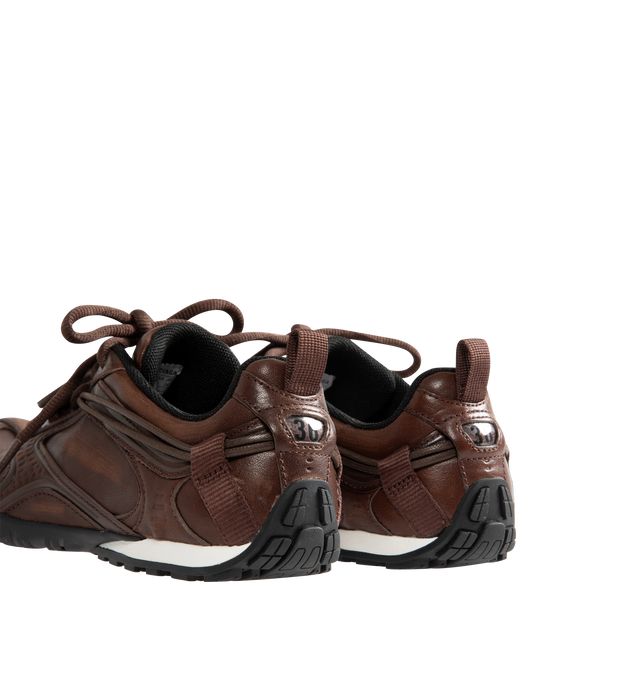 Image 3 of 5 - BROWN - Balenciaga Women's Radar Leather Sneakers are crafted from premium cowskin leather and feature a streamlined low-top silhouette with a distinctive worn-in finish, double lacing system, and debossed Balenciaga and 3B Sport logo detailing. Inspired by speed and technical performance, these designer sneakers are finished with a padded foam insole, durable rubber outsole with signature loop sports icon artwork, a back pull tab, and a sleek profile for elevated everyday wear. Upper: Cowski 