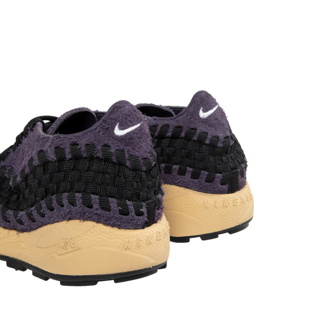 Image 3 of 5 - PURPLE - NIKE Air Footscape Woven Sneakers featuring a blue denim colored textile and soft suede upper, asymmetrical woven details, lateral lacing, foam midsole, Nike Air cushioned heel and rubber outsole. 