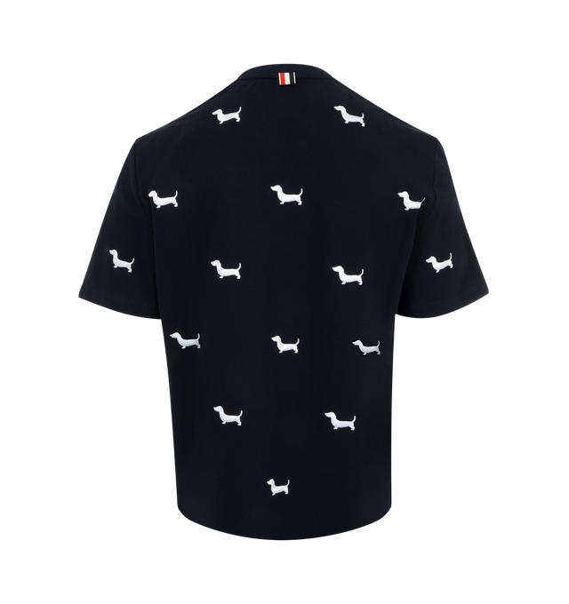 Image 2 of 2 - NAVY - Thom Browne Men's Classic Pique Short Sleeve Tee adorned allover with Thom Brownes very own dachshund Hector. Hector embroidery is crafted with luxurious satin stitching using white polyneon thread. Featuring name tag applique, buttoned side vents with signature striped grosgrain trim and signature striped grosgrain loop tab. 100% Cotton. Made in Italy. 