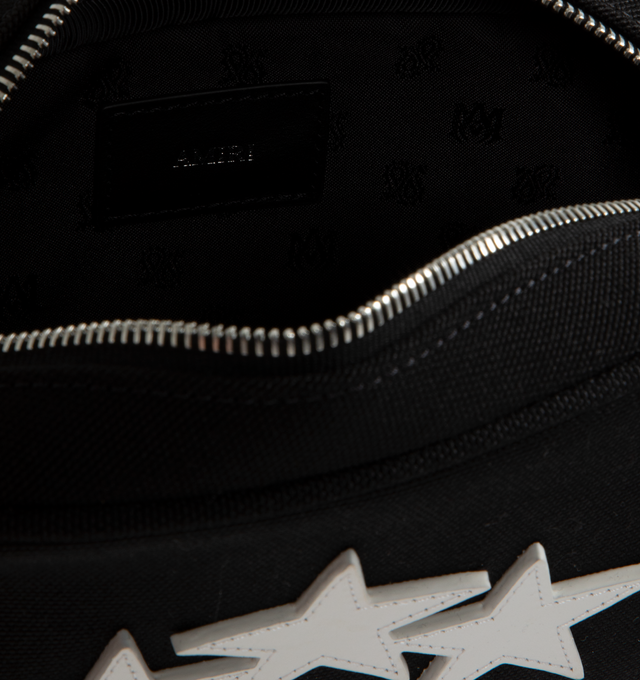 Image 5 of 5 - BLACK - Amiri 3-Star Camera Case has a zipper closure, an adjustable leather strap, custom hardware, and leather star appliques. Cotton and leather. Made in Vietnam.  