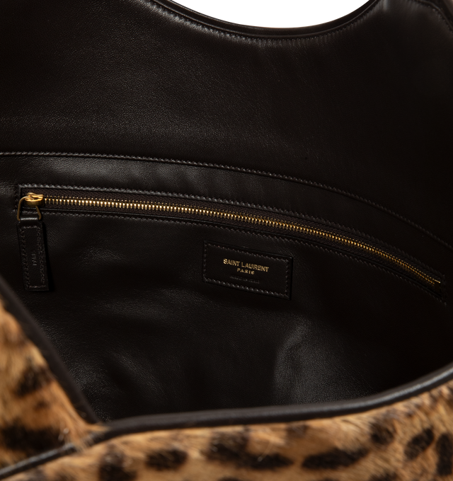 Image 3 of 3 - MULTI - Saint Laurent Icare Medium in Pony Hair Leather is crafted from leopard-print pony hair calfskin and features the houses iconic Icare silhouette in a versatile medium size. Designed for multiple carrying options, this spacious handbag is finished with leather lining and bronze-tone hardware. Fits a large phone, wallet, keys, and everyday essentials. Main Material: Calfskin. Hardware: Brass. Lining: Leather. Dimensions: 31-46 x 28 x 5-15 cm / 12.2-18.1 x 11 x 2-5.9 in. Handle Drop: 20  