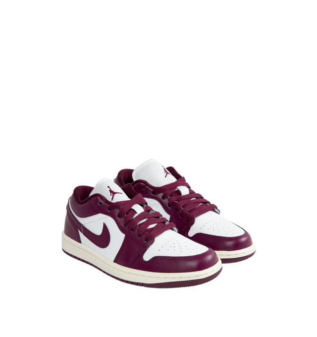 Image 2 of 5 - PURPLE - Air Jordan 1 Low Sneakers are a lace-up style with leather uppers, Air-Sole units for cushioning, and solid rubber outsoles.  