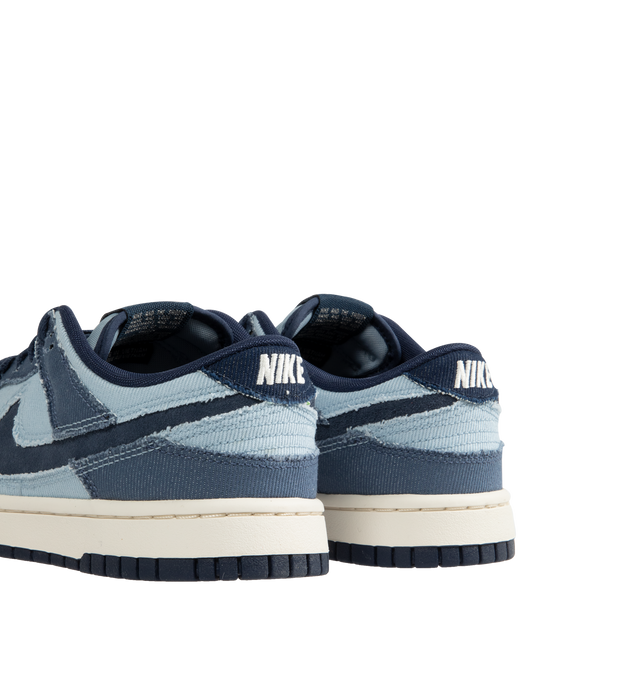 Image 3 of 5 - BLUE - Nike Dunk Low Sneakers with Armory Blue and Midnight Navy color-blocking,  a padded, low-cut collar, leather upper with a slight sheen and durability, foam midsole offering lightweight, responsive cushioning. Perforations on the toe add breathability. Rubber sole with classic hoops pivot circle provides durability and traction. 