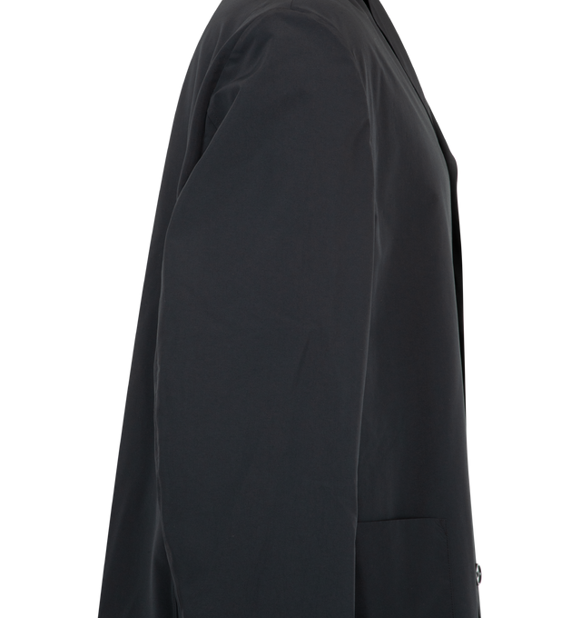 Image 3 of 3 - BLACK - Jil Sander Mens Sport Jacket is a Single-Breasted Tailored Jacket is crafted from lightweight technical fabric. Features a relaxed fit, notched lapels, button-front closure, long sleeves, two front patch pockets, and a straight hem. Main Material: 100% Polyester. Made in Italy. 