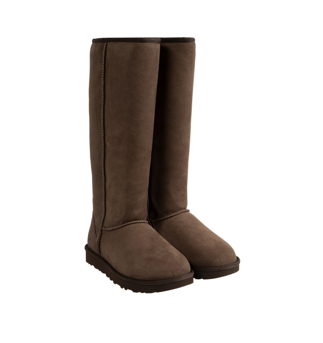 Image 2 of 4 - BROWN - Ugg Women's Classic Ultra Tall Boot is a sky-high version of the iconic style. Featuring a 15-inch shaft height, plush sheepskin lining, and an ultra-lightweight rubber outsole for comfort. Main Material: 17mm Twinface Sheepskin. Lining: 17mm Sheepskin. Insole: 17mm Sheepskin. Sole: Sugarcane EVA. Details: Overlock Stitch Seams.  
