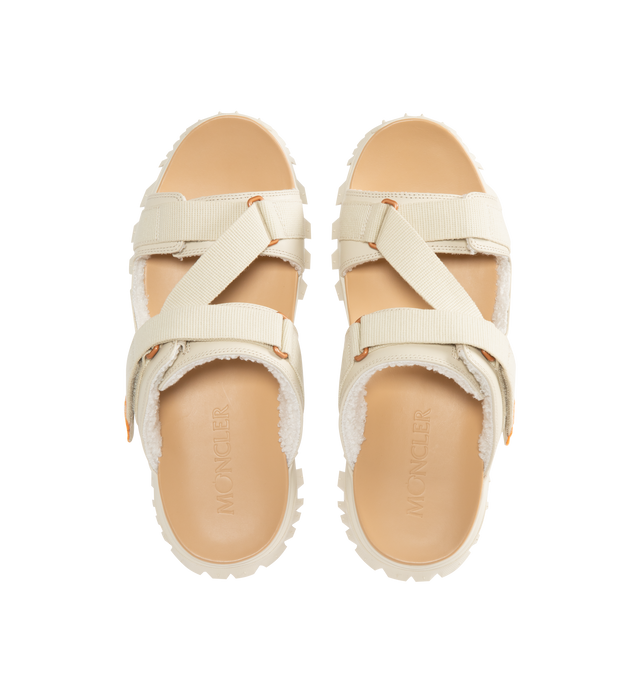 Image 4 of 4 - WHITE - Moncler x Gilga Farm Designed by Donald Glover Trailgrip Vela Leather Sandals featuring upper in leather and cotton, faux fur insole, EVA midsole, special Vibram MEGAGRIP rubber compound tread, EVA ergonomic insole and strap closure. Sole height 4.5 cm. Upper: 100% cotton. 100% cow. Lining: 100% polyester. Sole: 100% elastodiene. Made in Vietnam. 