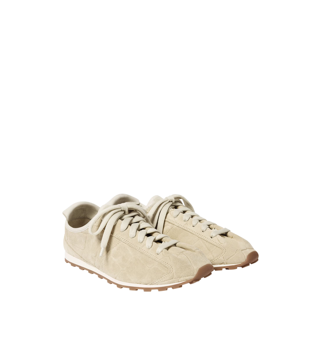 Image 2 of 4 - WHITE - JACQUEMUS Tennis Sneaker featuring soft sneakers in soft crocodile-embossed suede, almond-shaped toe, flat laces, embossed logo on the tongue, embossed logo on the heel tab, removable leather-covered insole and rubber outsole in a round and square shape. 100% calf leather. Outsole: 100% thermoplastic polyurethane. Made in Portugal. 