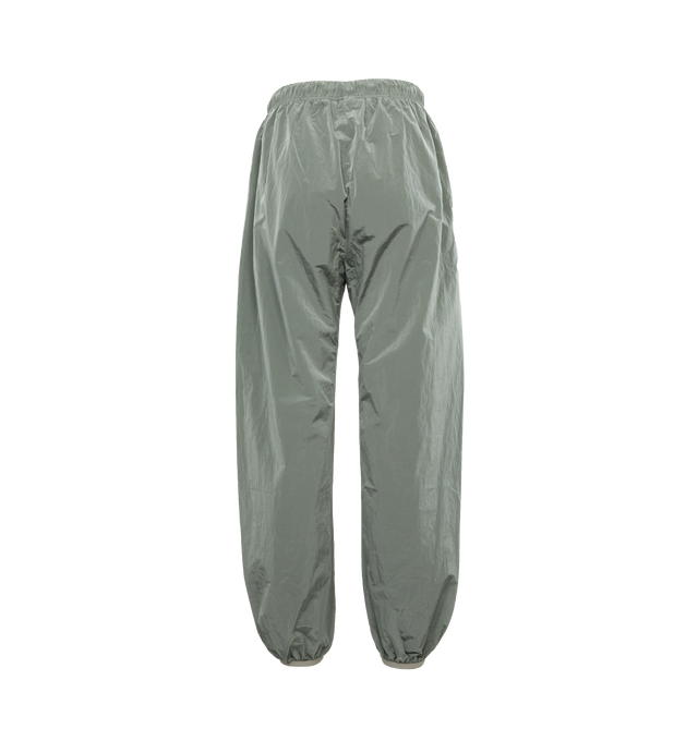 GREY - FEAR OF GOD ESSENTIALS Nylon Track Pants featuring drawstring at elasticized waistband, rubberized logo patch at front, two-pocket styling, zip vent at elasticized cuffs and fully lined. 100% nylon. Lining: 100% polyester. Made in China.