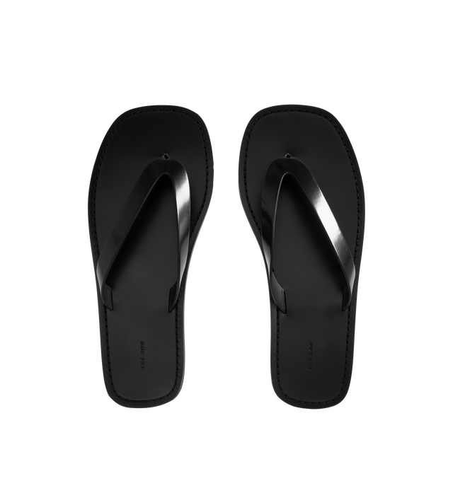 Image 4 of 4 - BLACK - THE ROW City Flip Flop featuring refined flip flop sandal in glossy calfskin leather with contrast leather footbed, stitched detailing, and lightly treaded rubber sole. 100% calfskin leather. Made in Italy. 