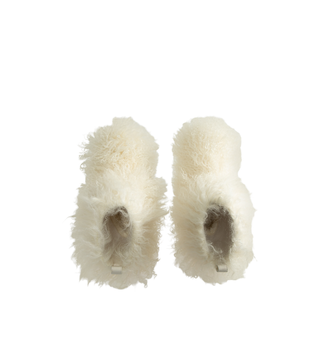 Image 4 of 4 - WHITE - UGG Women's Classic Short Fluff Momma Boot is crafted from long sheepskin and features a statement short-boot silhouette, an 8-inch shaft, and a rear pull tab. Designed with plush UGGplush lining and sockliner for comfort and warmth, this style is finished with a lightweight sugarcane EVA outsole and recycled polyester textile binding. Main Material: Long Sheepskin. Vamp Lining: 17mm UGGplush (60% Upcycled Wool, 40% TENCEL Lyocell). Shaft Lining: Textile. Sockliner: 17mm UGGplush (60% 