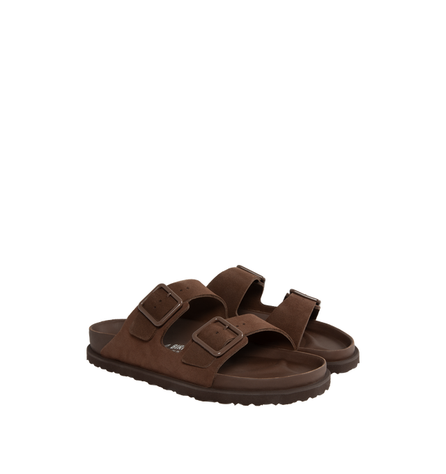 Image 2 of 4 - BROWN - Birkenstock's Arizona sandals in a regular width. The iconic Arizona sillhouette is  updated in suede featuring adjustable straps with buckle closures, logo details, shaped insole, and EVA outsole. Upper: Luxurious fine flesh out suede, a full grain leather that has been flipped to use the fuzzy side. Footbed: Anatomical shaped BIRKENSTOCK cork-latex footbed, covered with premium, color-matching smooth nappa leather. Sole: EVA outsole with a 3mm EVA welt updates the standard die-cut o 
