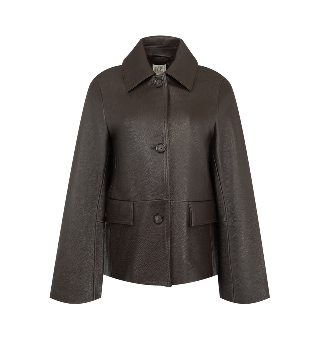 Image 1 of 2 - BROWN - Toteme Women's Grained Leather Jacket is crafted from heavyweight grained cow leather and features a straight silhouette with a clean button-front closure for a sharp, effortless fit. Finished with flap pockets and a smooth satin lining, this designer leather jacket combines refined craftsmanship with Toteme's signature minimalist aesthetic, creating a timeless outerwear essential for everyday wear. Main Material: 100% Cow Leather. Lining: 100% Viscose. 