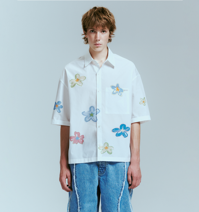 Image 2 of 4 - WHITE - NAHMIAS Super Bloom Cropped Shirt featuring front button closure, single chest pocket, midweight poplin fabric, spread collar and placed super bloom graphic. 100% cotton. 