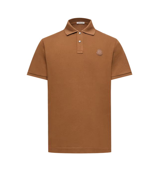 Image 1 of 1 - BROWN - Moncler Men's Logo Patch Cotton Piquet Polo Shirt is crafted from pure cotton piquet and features a timeless short-sleeve silhouette designed for versatile everyday wear. Cut in a regular fit, this designer polo is finished with a classic collar, snap-button closure, ribbed collar and cuffs, and a leather Moncler logo patch for a refined signature detail. Main Material: 100% Cotton. Collar and Cuffs: 99% Cotton, 1% Elastane/Spandex. Leather Tag: Cow Leather. Fit: Regular. Closure: Sna 