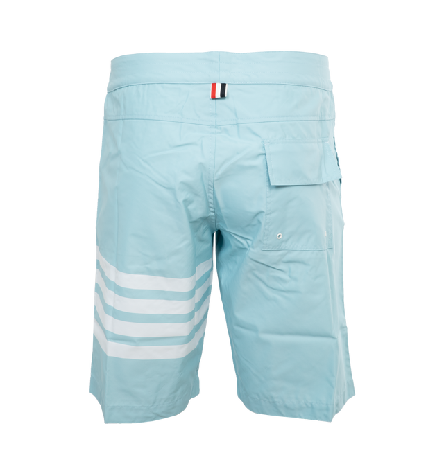Image 2 of 3 - BLUE - THOM BROWNE Board Shorts have a drawstring waist, 4 bar detail on the left thigh, single flap back pocket, slant side pockets, and name tag above the left cuff. 94% polyamide, 6% polyurethane. Lining: 100% polyester. Made in Itlay.  