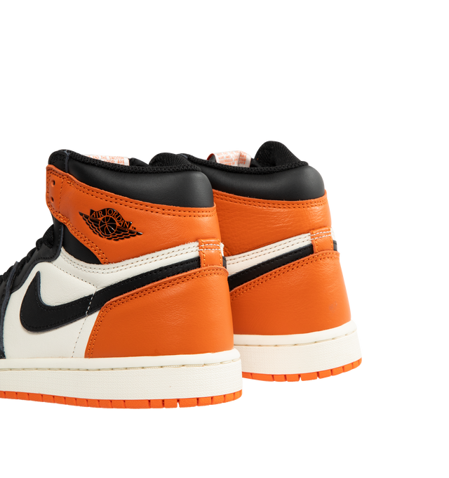 Image 3 of 5 - ORANGE - JORDAN Air Jordan 1 Retro High OG Sneaker featuring encapsulated Air-Sole units, solid rubber outsole, genuine leather, wings logo stamped on collar, stitched-down Swoosh logo, rubber traction and foam sole. 