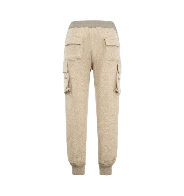 Image 2 of 3 - NEUTRAL - Rick Owens Men's Mastodon Cargo Pants are crafted from a wool and cotton blend and feature a slim cargo silhouette with an elasticized drawstring waistband. Designed with a concealed fly and button closure, the style is finished with cargo pockets on both sides for a utilitarian look. Main Material: 65% wool, 35% cotton. 