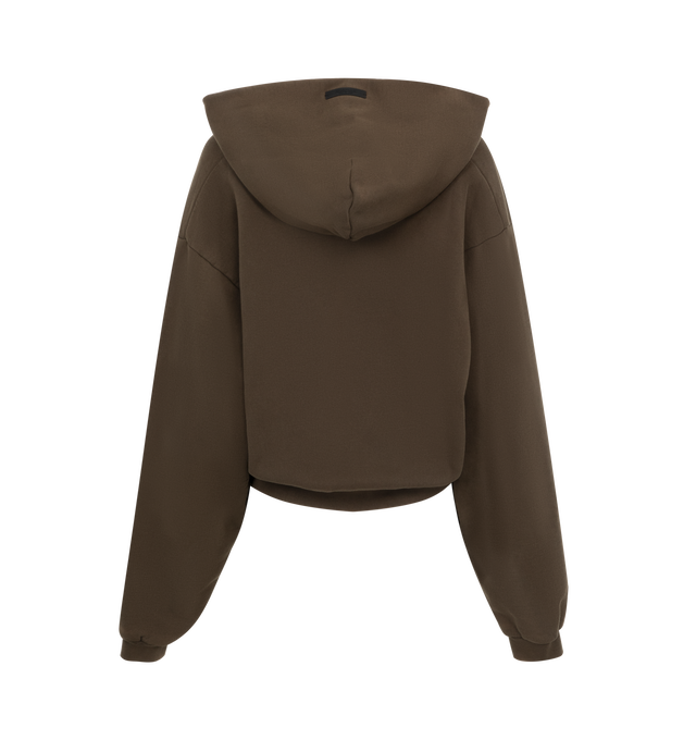 Image 2 of 2 - BROWN - Fear of God Essentials Womens  V-neck cropped, boxy hoodie crafted from heavy cotton fleece featuring an old-English logo university crest graphic at the front, ribbed trims and raw cut v-neck and signature rubberized patch on the hood. 100% Cotton. 