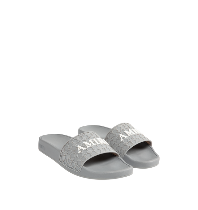 Image 2 of 4 - GREY - AMIRI MA Quad Pool Slides featuring rubber pool slides, logo pattern embossed throughout, open toe, logo embossed at vamp and outer side, molded rubber footbed and treaded rubber sole. Rubber.  