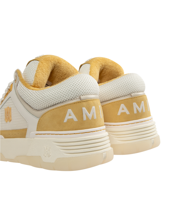 Image 3 of 5 - CHAMPAGNE - Amiri MA-1 Sneakers are a lace-up style with two-tone uppers, a double lace fastening, MA icon hardware, a logo at the back, and exaggerated rubber outsoles. 100% leather uppers. Made in Vietnam.  