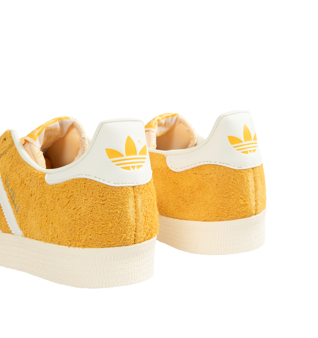 Image 3 of 5 - YELLOW - Adidas Classic Gazelle Sneakers are a lace-up style with satin uppers, suede and synthetic overlays, and gum outsoles. Textile linings.  