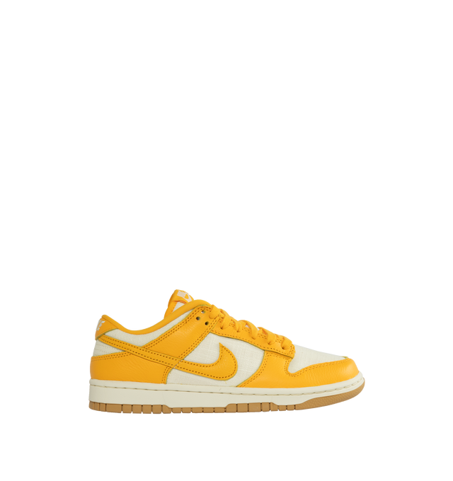 Image 1 of 5 - YELLOW - NIKE Dunk Low Retro Basketball Sneaker featuring lace-up style, removable insole, leather and textile upper, synthetic lining and rubber sole.  