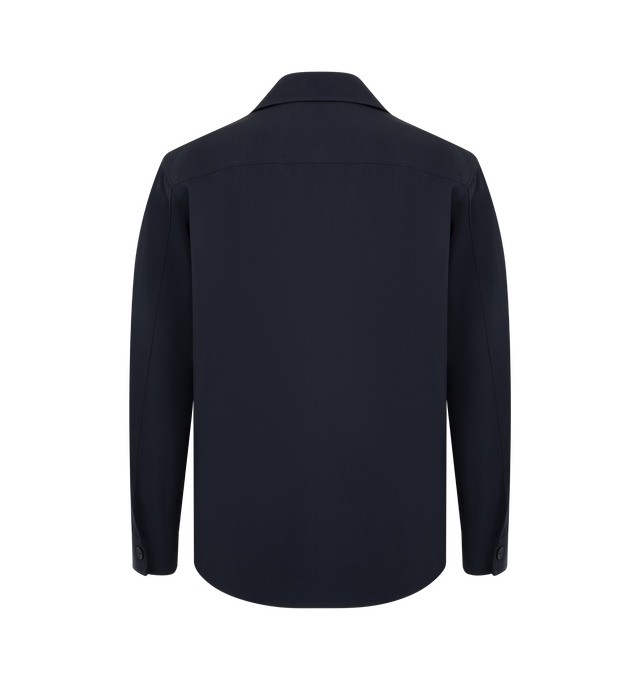 Image 2 of 3 - NAVY - THE ROW Oslo Jacket featuring collared jacket in lightweight suiting with loose fit, pressed center back pleat, slightly curved hem and horn button closure. 55% linen, 45% viscose. Made in Italy. 