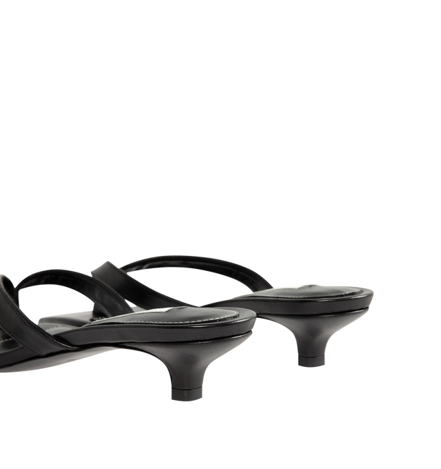 Image 3 of 4 - BLACK - Toteme Women's Leather Heeled Flip Flops are crafted in Italy from smooth, responsibly tanned leather and feature a minimalist thong silhouette with an open toe and easy slip-on construction. Set on a low 35mm heel, these designer sandals are finished with a leather lining and leather outsole, combining understated elegance with Toteme's signature minimalist aesthetic. Upper: Responsibly Tanned Leather. Lining: Leather. Outsole: Leather. Heel Height: 35 mm / 1.4 in. Made in Italy. 