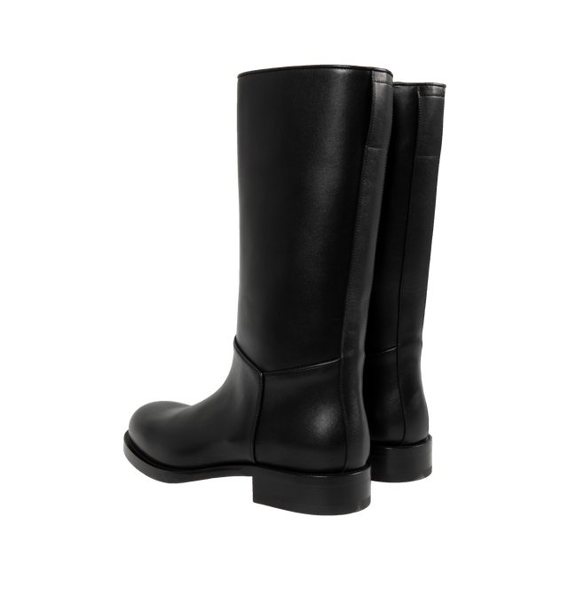 Image 3 of 4 - BLACK - THE ROW Nobilis Riding Boot featuring classic riding boot in silky polished leather with round toe and stacked heel. 1.4 in. heel. 100% calfskin leather. Lined in 100% leather. Made in Italy. 