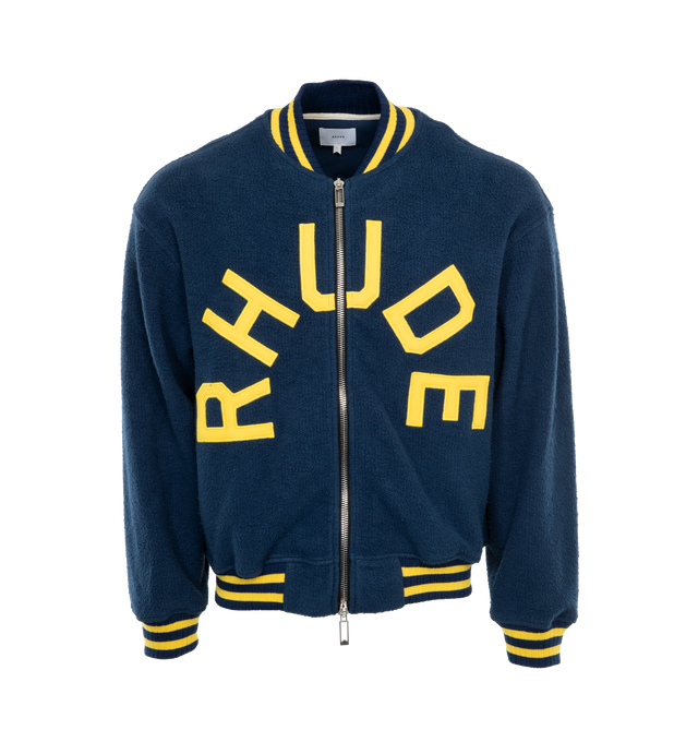 NAVY - RHUDE Oversized Logo Terry Varsity Jacket featuring oversized fit, varsity logo at front, striped rib-knit collar, cuffs and waistband, zip front closure, sropped shoulders and long sleeves. Made in USA.