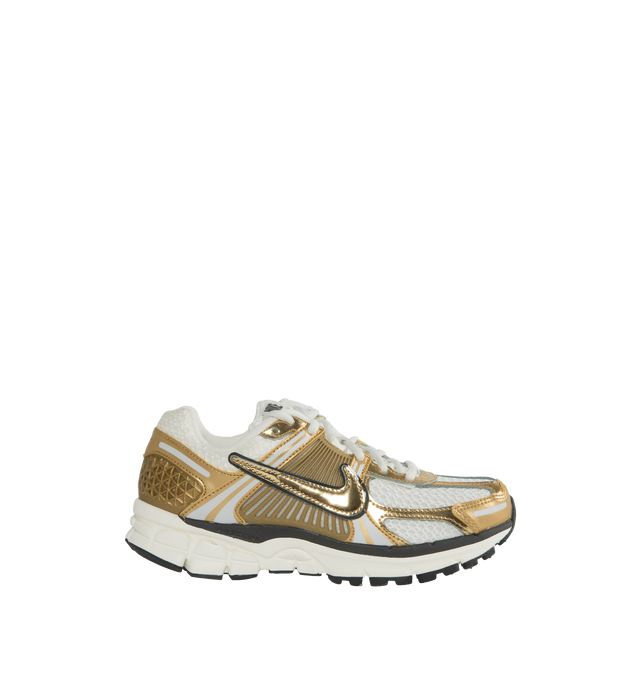 GOLD - NIKE Zoom Vomero 5 Premium Sneaker featuring mesh upper, synthetic overlays, swoosh overlays, padded tongue with Nike branding, TPU heel counter, traditional lacing system, cushion foam midsole, Zoom Air technology and rubber outsole.