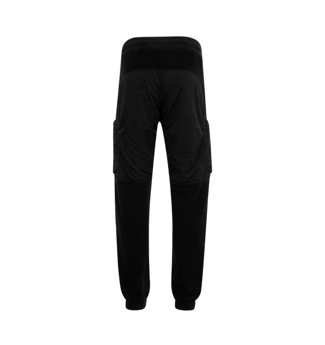 Image 2 of 3 - BLACK - STONE ISLAND Fleece Sweatpants featuring panelled design, signature detachable Compass badge, elasticated drawstring waistband, tapered leg, elasticated ankles, two side slit pockets and two side zip-fastening pockets. 86% cotton, 14% polyamide. 