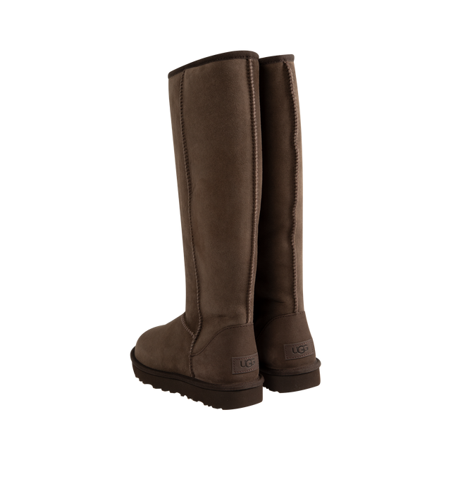 Image 3 of 4 - BROWN - Ugg Women's Classic Ultra Tall Boot is a sky-high version of the iconic style. Featuring a 15-inch shaft height, plush sheepskin lining, and an ultra-lightweight rubber outsole for comfort. Main Material: 17mm Twinface Sheepskin. Lining: 17mm Sheepskin. Insole: 17mm Sheepskin. Sole: Sugarcane EVA. Details: Overlock Stitch Seams.  