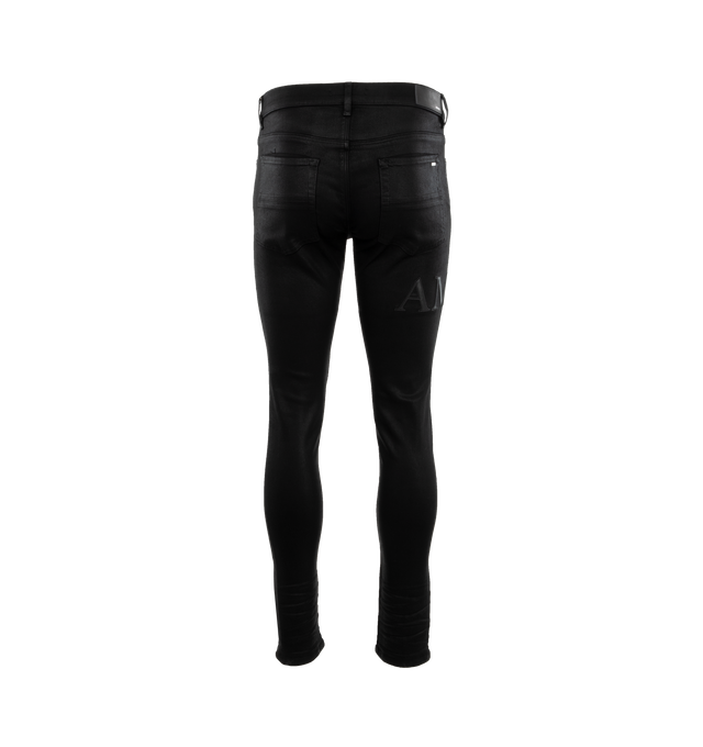 Image 2 of 3 - BLACK - AMIRI Serif Logo Wax Skinny Jean featuring logo on right leg, regular rise, five-pocket style, full length, skinny legs, button zip closure and belt loops. Cotton/polyester/elastane. 