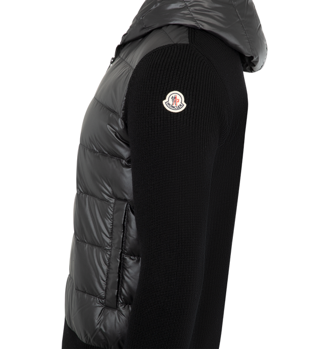 Image 3 of 3 - BLACK - MONCLER Padded Wool Zip-Up Hoodie featuring down-filled polyester front and hood, rib knit, gauge 7, zipper closure and pockets with snap button closure. 100% polyester. 100% virgin wool. Padding: 90% down, 10% feather. Made in Turkey. 