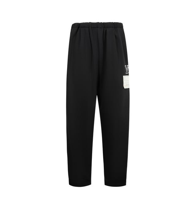 Image 1 of 3 - BLACK - Maison Mihara Yasuhiro Men's Amateur Sewn Track Pants feature an elastic waistband, signature embroidered logo detailing, side striped trim, side pockets, and a back pocket for a sporty yet elevated look. These designer track pants combine everyday comfort with the brand's contemporary aesthetic, making them a versatile choice for casual and streetwear styling. Material: 100% Polyester. 