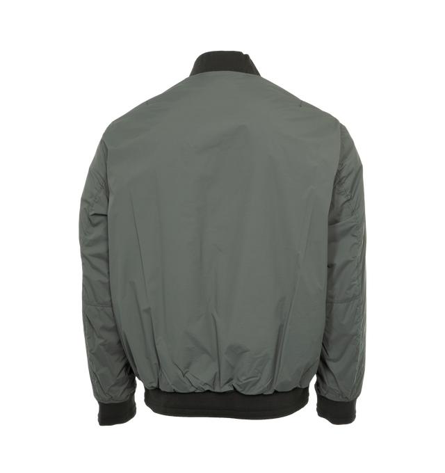 Image 2 of 3 - GREEN - STONE ISLAND Bomber Jacket featuring rib knit stand collar, hem, and cuffs, two-way zip closure, welt pockets, detachable logo patch at sleeve and full taffeta lining. 89% polyamide, 11% elastane. Made in Indonesia. 