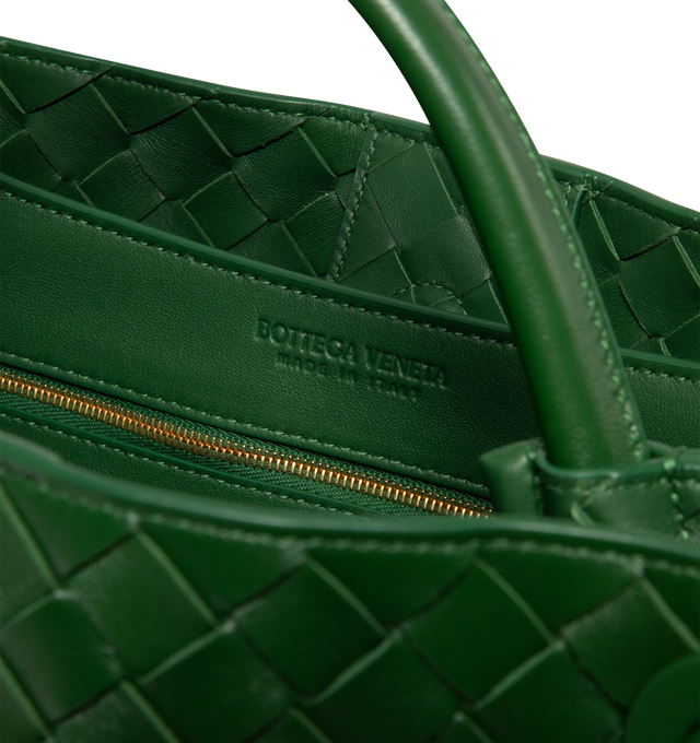Image 4 of 4 - GREEN - BOTTEGA VENETA Andiamo Bag featuring top handle bag in supple Intrecciato leather with signature knot detail, sliding cross-body strap, compartmented interior with one zippered pocket, two open pockets and magnetic closure. 9.8 x 12.6 x 4.3. Lambskin. Made in Italy. This item may be restricted for online purchase to international clients. For assistance purchasing this item please contact our dedicated stylist team at personalshopping@hirshleifers.com. 