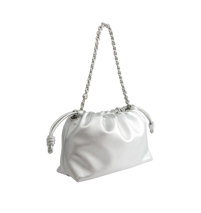 Image 2 of 4 - SILVER - Loewe Medium Flamenco purse in laminated lambskin, defined by a ruched design with key details such as the signature knots at the sides and the donut chain. This medium version is crafted in laminated lambskin. Shoulder, crossbody or hand carry with detachable and adjustable leather strap and detachable donut chain adorned with an Anagram Pebble. Features magnetic closure, suede lining and embossed LOEWE. Height 7.9 X Width 11.8 X Depth 4.1 inches. Made in Spain. 