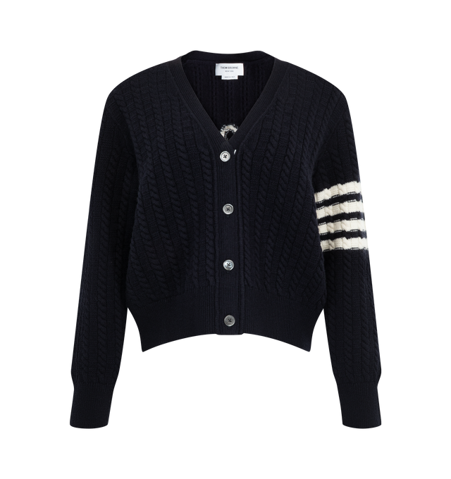 Image 1 of 2 - NAVY - Thom Browne Women's Merino Wool 4-Bar Anchor Intarsia Cardigan is crafted from virgin wool and features a baby cable-stitch construction, a V-neckline with ribbed trim, and a contrast anchor intarsia at the back inspired by the brand's nautical heritage. Designed with a front button closure accented by an RWB grosgrain placket, it is finished with ribbed cuffs and hem, signature 4-Bar detailing, and a striped grosgrain loop tab. Main Material: 100% Virgin Wool. Made in Italy. 