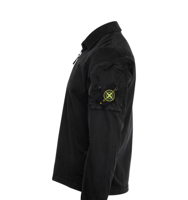 Image 3 of 3 - BLACK - Stone Island Stretch Broken Twill Overshirt has a spread collar, a zip front closure, side pockets, a zipper sleeve pocket, a brand logo badge, snaps at the cuffs, and a back yoke. 98% cotton, 2% elastane/spandex. Made in Romania.  