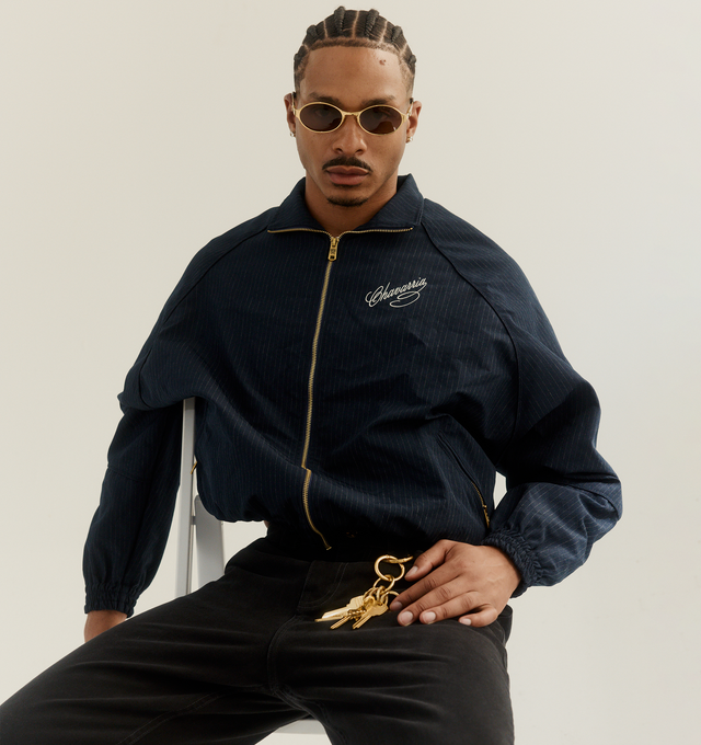 Image 2 of 3 - BLUE - WILLY CHAVARRIA Ruff Rider Jacket featuring a stand collar, elasticated edges, zip front, zip front pockets and logo on chest. 63% polyester, 37% viscose.  