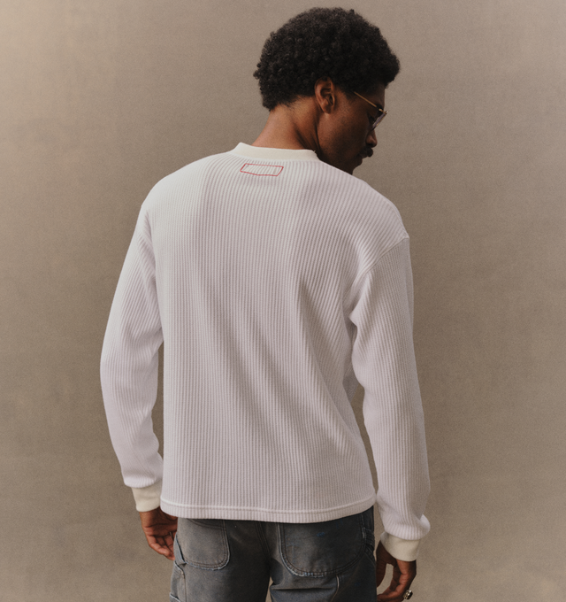 Image 6 of 6 - WHITE - Cherry LA Men's Henley Thermal is crafted from a custom poly-cotton thermal fabric and features a fitted silhouette with a classic Henley neckline. Designed with embroidered detailing at the back and finished with two-hole cat-eye buttons, this everyday essential combines vintage-inspired thermal styling with Cherry LA's signature craftsmanship. Main Material: Custom Poly-Cotton Thermal. Made in Los Angeles, California. 