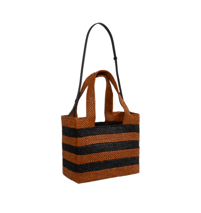 Image 2 of 3 - BROWN - Loewe Paula's Ibiza Logo Front Tote with Stripes is a cuboid bag adorned with a contrasting LOEWE signature. This medium version features two-tone stripes and is made in Spain using raffia palm that is cultivated, harvested, sun-dried and woven in Madagascar by local artisans. Features detachable and adjustable shoulder strap  for hand carry or shoulder carry.  Height (inch): 10 X Width (inch): 11.8 X Depth (inch): 5.9. Made in Portugal.Loewe Paula's Ibiza 2024 collection is inspired  