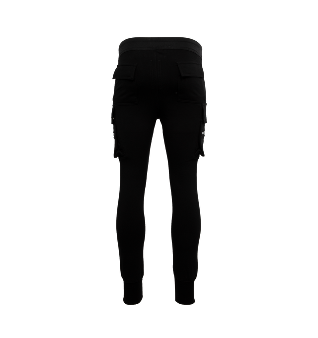 BLACK - RICK OWENS Mastodon Cargo Sweatpants featuring elasticated drawstring waist, tapered leg, side slit pockets, back pockets and zipped pockets. 100% cotton.