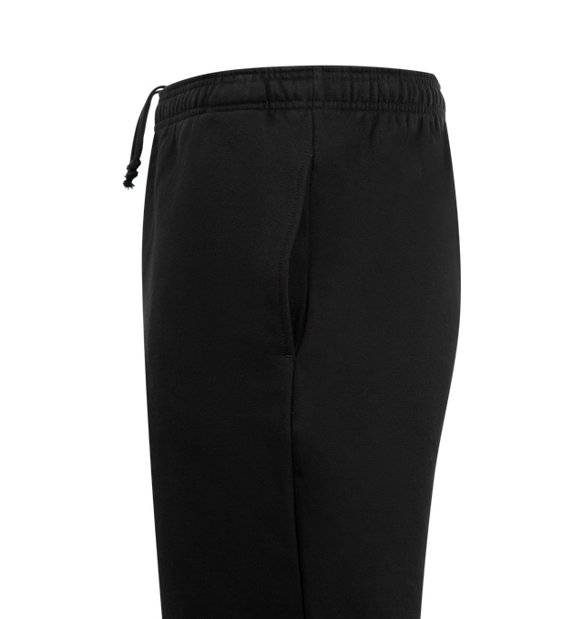 Image 4 of 4 - BLACK - PLEASURES Pipe Sweatpants featuring elastic waist with concealed drawstring, side pockets, loose fit, logo down leg and toggle at hem. Cotton. 