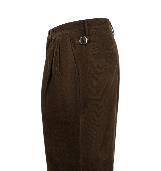 Image 3 of 3 - BROWN - Kaptain Sunshine Corduroy Mud-Dyed Shoecut Slacks are crafted from high-density cotton corduroy woven with yarns of varying counts and feature a relaxed-fit silhouette, a mid-rise waist, two front pleats, and side buckle adjusters. Dyed using an artisanal mud-dyeing process that utilizes iron-rich mud from Japan's Kyushu region, the trousers develop a rich Natural Dark Mud color through repeated dyeing and washing by skilled craftspeople. Designed with a subtle shoecut leg shape, this 