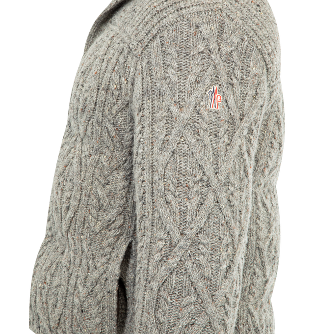 Image 3 of 3 - GREY - MONCLER GRENOBLE Ellesmere Wool Tweed Short Down Jacket featuring merino wool tweed, rainwear lining, down-filled and padded, argyle and cable knit, gauge 1.5, snap button closure and side pockets. 100% virgin wool. Lining: 100% polyamide/nylon. Padding: 90% down, 10% feather. Made in Romania. 