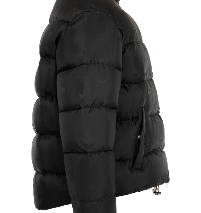 Image 3 of 3 - BLACK - Rhude Men's Paisley Jacquard Down Puffer Jacket is crafted from polyester satin with an allover paisley-inspired jacquard logo pattern and features a down-filled silhouette designed for warmth and volume. Designed with a stand collar, two-way zip closure, welt pockets, elasticized cuffs, interior zip pockets, and a bungee-style drawstring hem for adjustable comfort. Main Material: 100% Polyamide. Fill: 100% Goose Down. Lining: 100% Polyamide. 